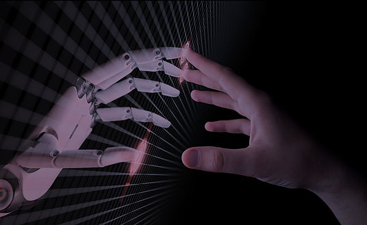 A robot hand and a human hand touching fingers